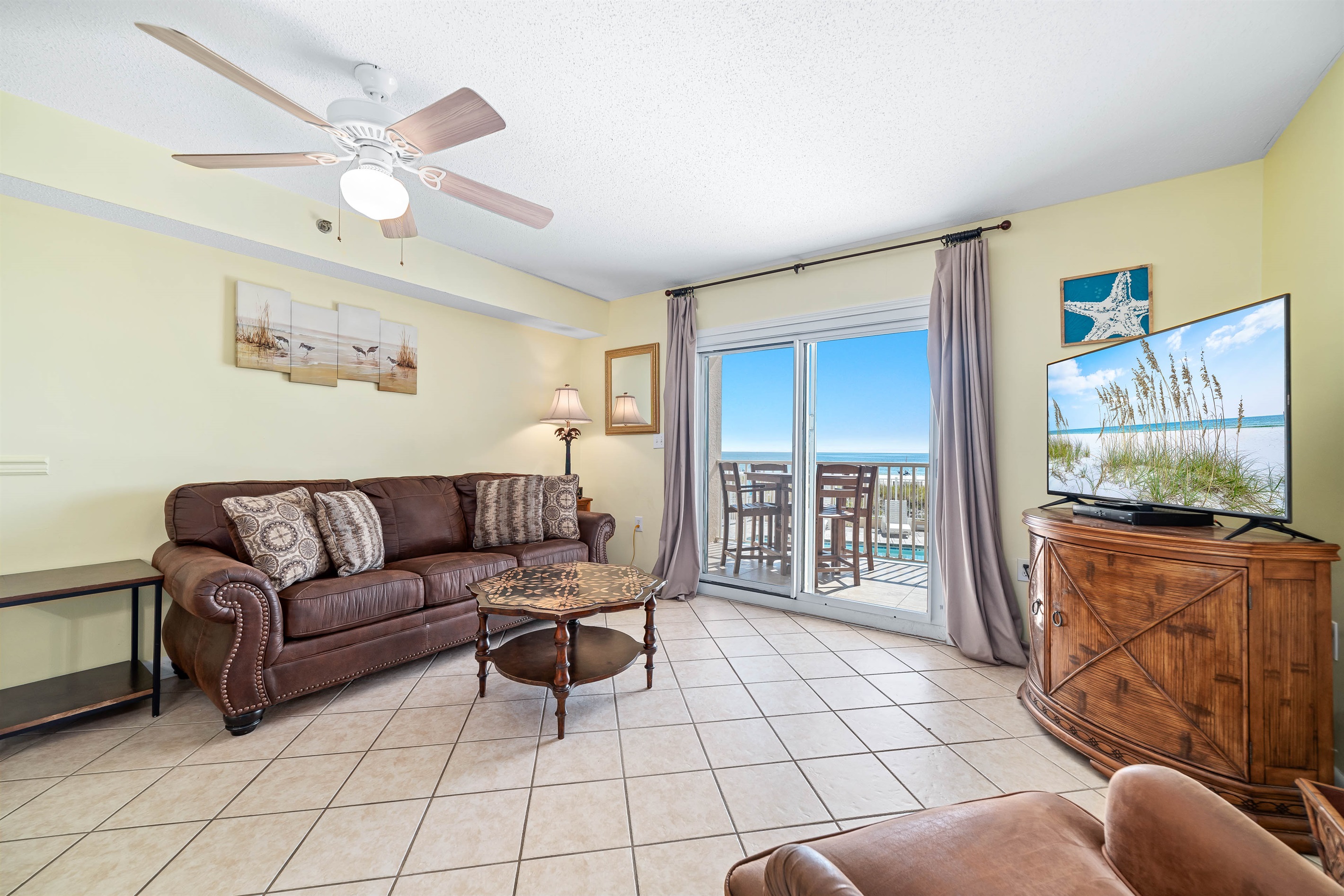 Maximize your comfort and sleeping arrangements with our versatile living area, showcasing a convenient sleeper sofa. Enjoy stunning panoramic ocean vistas right from your accommodation.