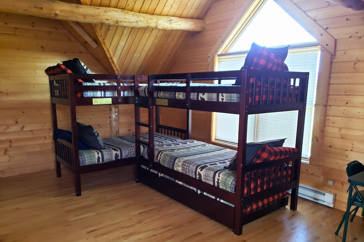Loft bunk house has 2 sets of twin bunk beds.