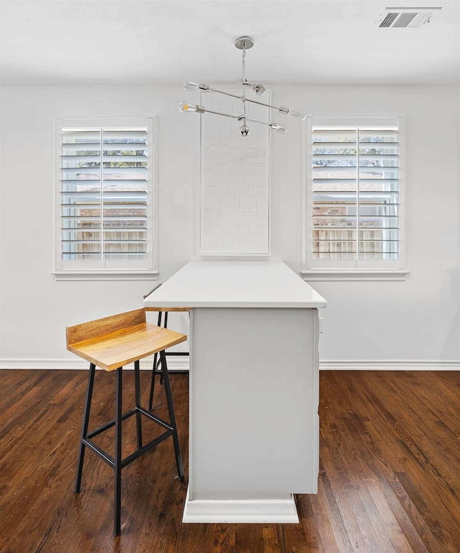 Bright dining space with modern seating, warm wood floors, and an open layout that flows seamlessly into the kitchen and gathering areas. ✨🍽️