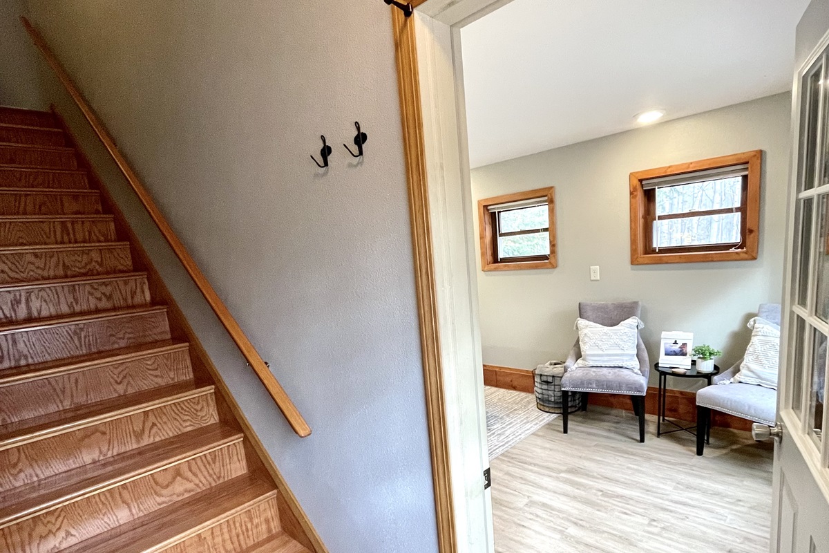 stairs to second level    *note bedroom is on the main lower entry level must take stairs to access upper loft kitchen living bathroom* 