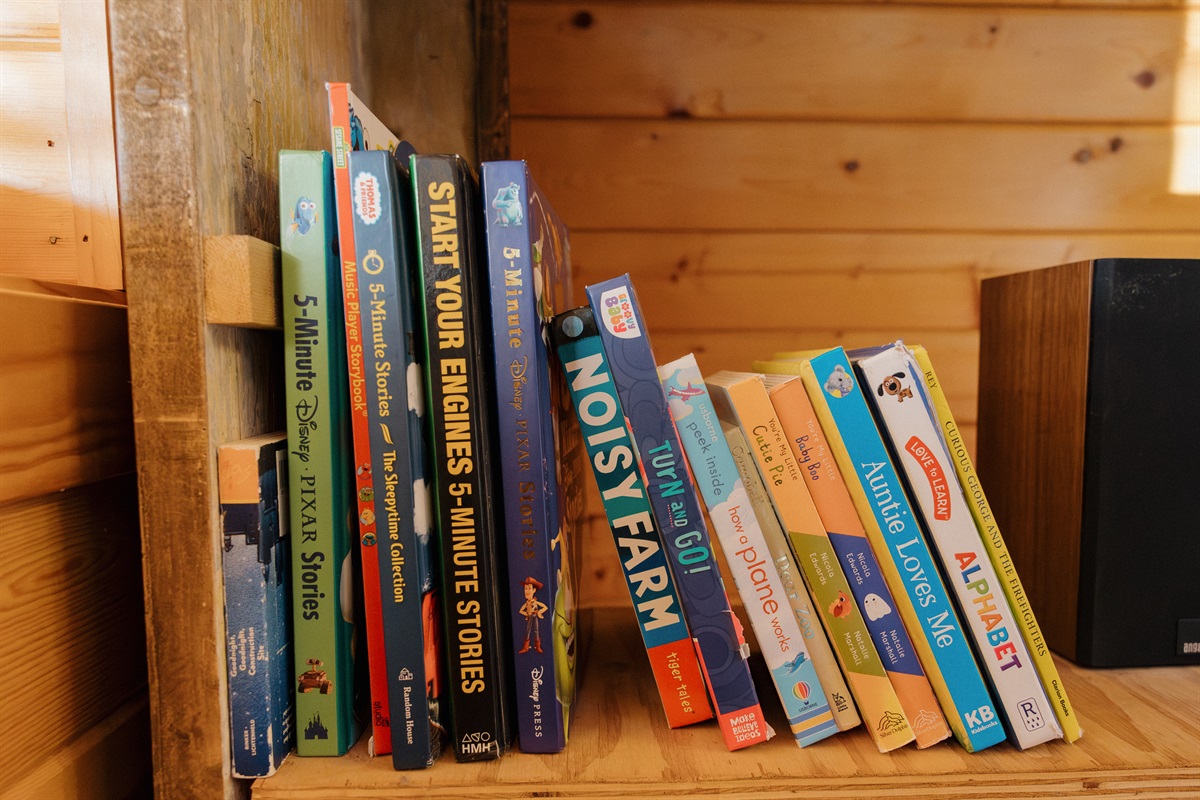 A curated library of books for all ages awaits at Poppywood Pines. From children's stories to adult reads, this family-friendly Show Low cabin provides entertainment for quiet evenings after exploring White Mountains hiking trails, lakes, and outdoor