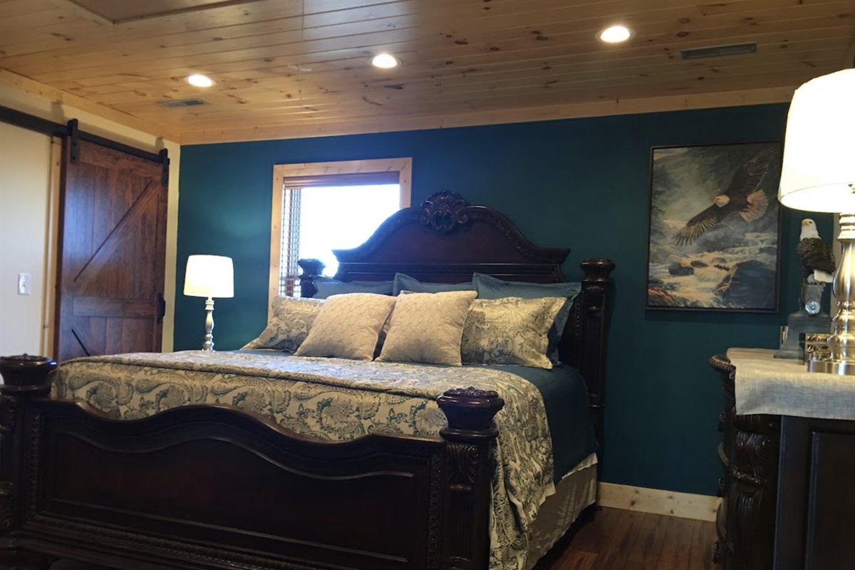 The Soaring Eagle Room is magnificent with a grand King Bed and a large barn-style door to your bathroom.