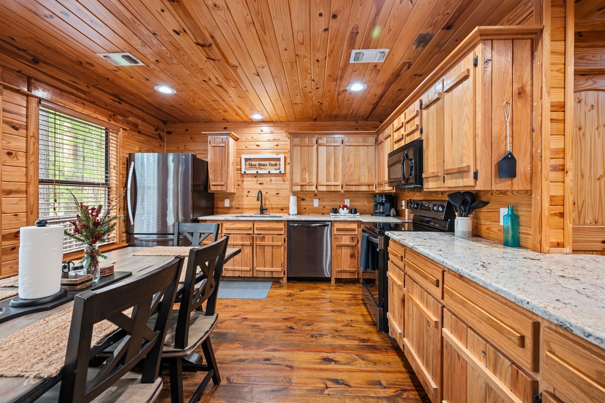 Outfitted with modern appliances and generous counter space, this kitchen makes preparing meals feel simple and enjoyable.