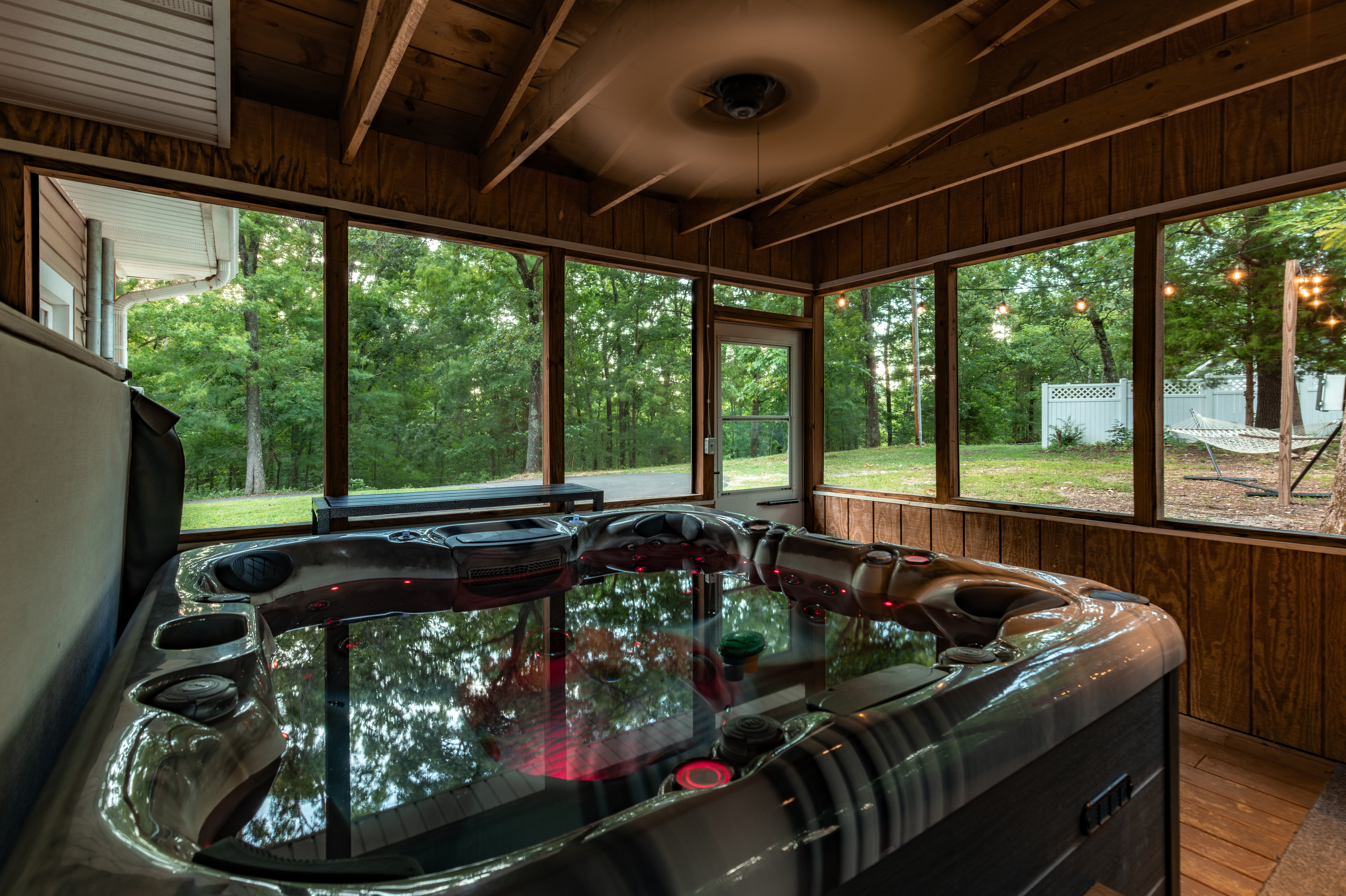 Soak together in the screened-porch hot tub—an all-weather family favorite after a full day on Kentucky Lake.