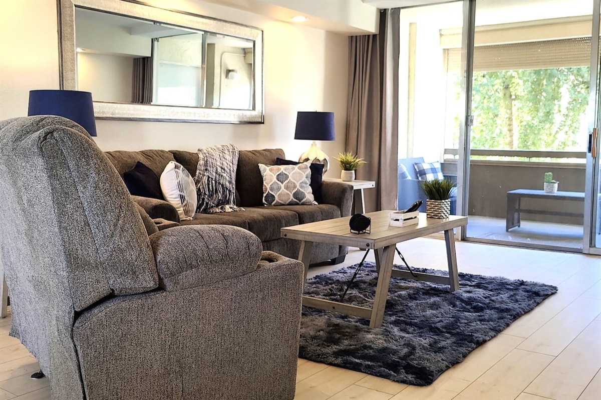 Relaxing living room includes queen sleeper sofa with memory foam mattress.