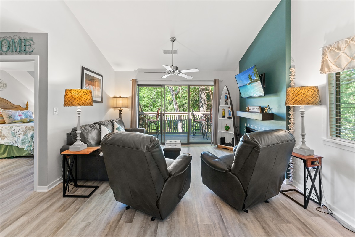 Large open Living room with large TV and patio access