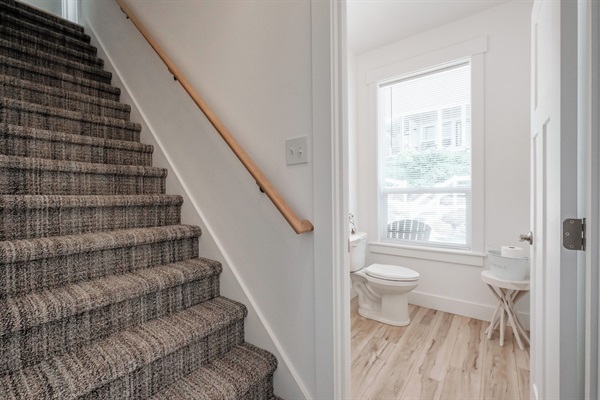 Natural light give this main-level powder room a warm, airy feel.