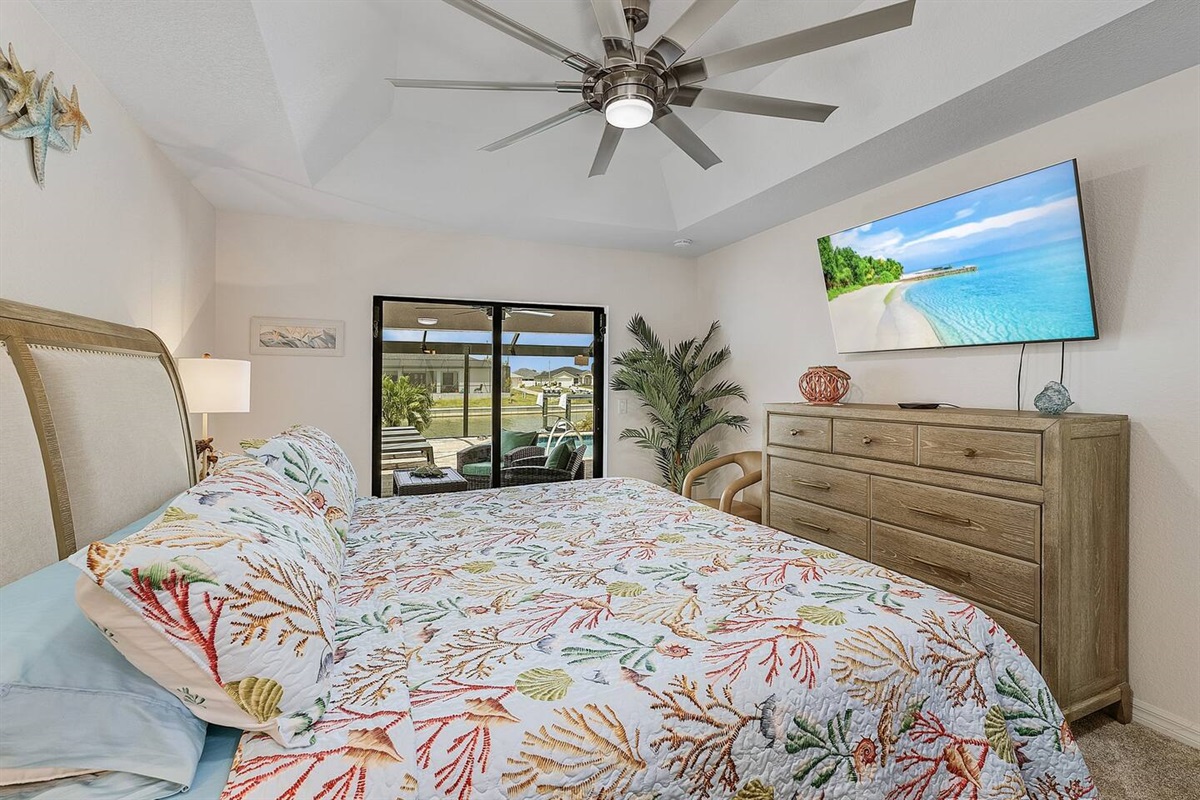 Primary suite with direct access to pool and lanai area.