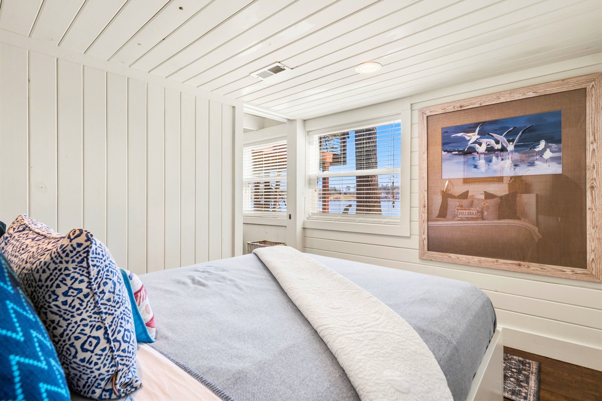 Enjoy this bright and comfortable bedroom where natural light and a thoughtfully arranged space create an easy, restful environment.