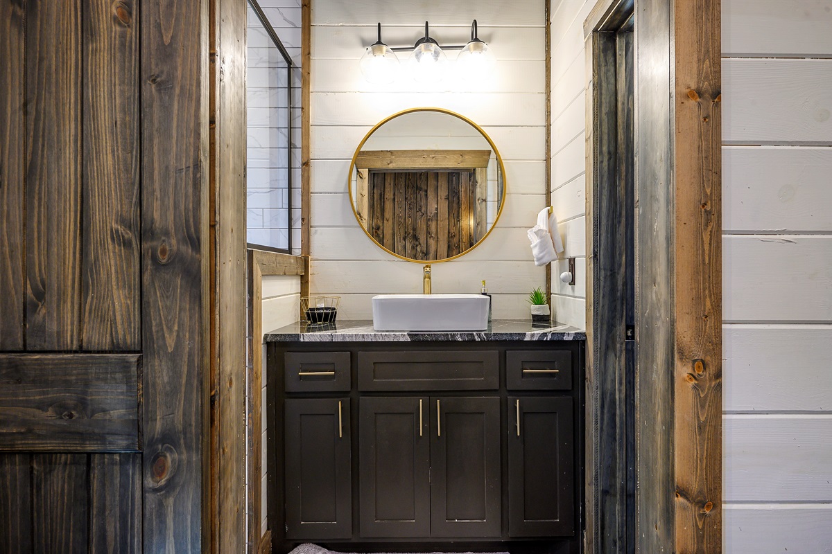 Chic bathroom with rustic door details