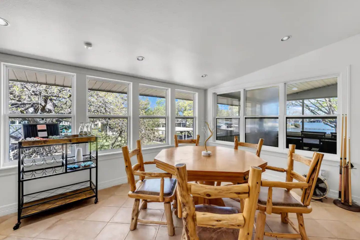 round dining table next to long rectangular dining table