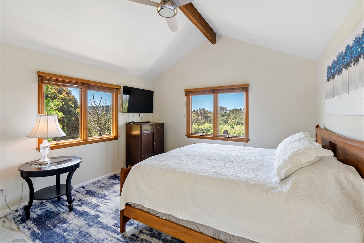 Sink into this plush queen bed and unwind with your favorite shows.