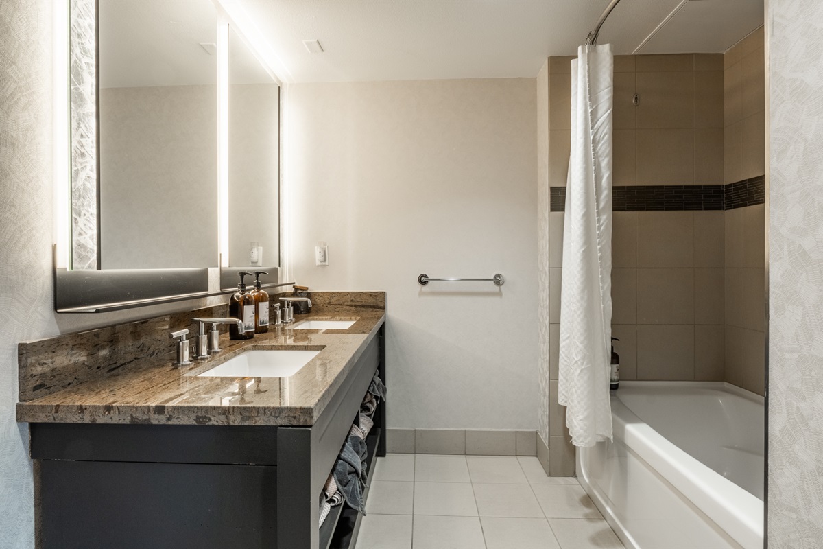 The oversized hall bathroom offers space to reset and refresh after full days outside.