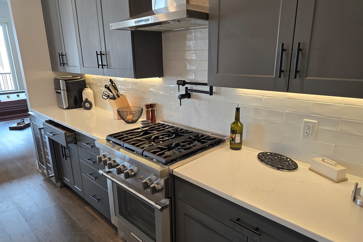Full Kitchen With Professional Stove and Vent and lighting system