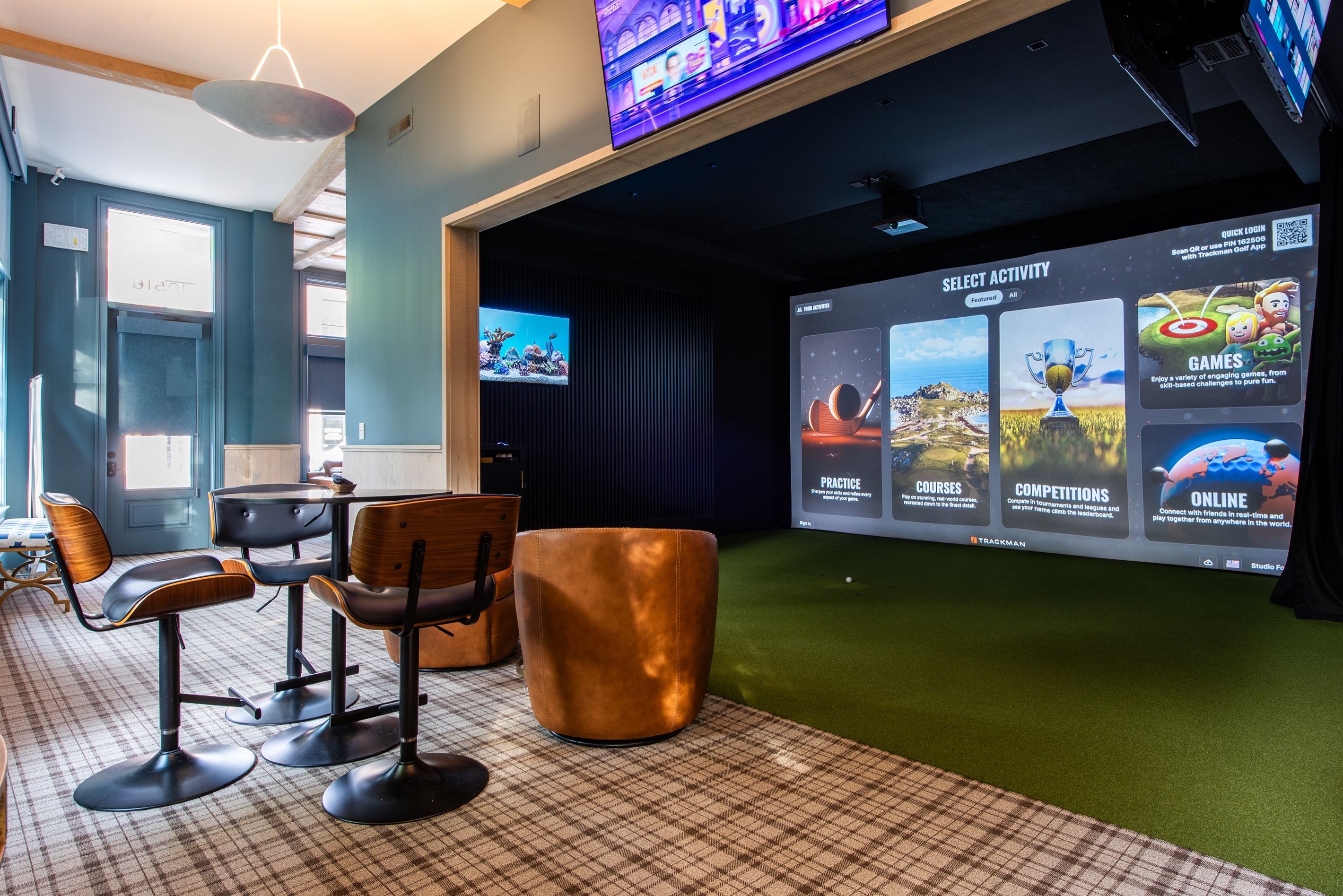 Relax and play in our luxurious golf simulator lounge, an exclusive, paid-access amenity for property guests.