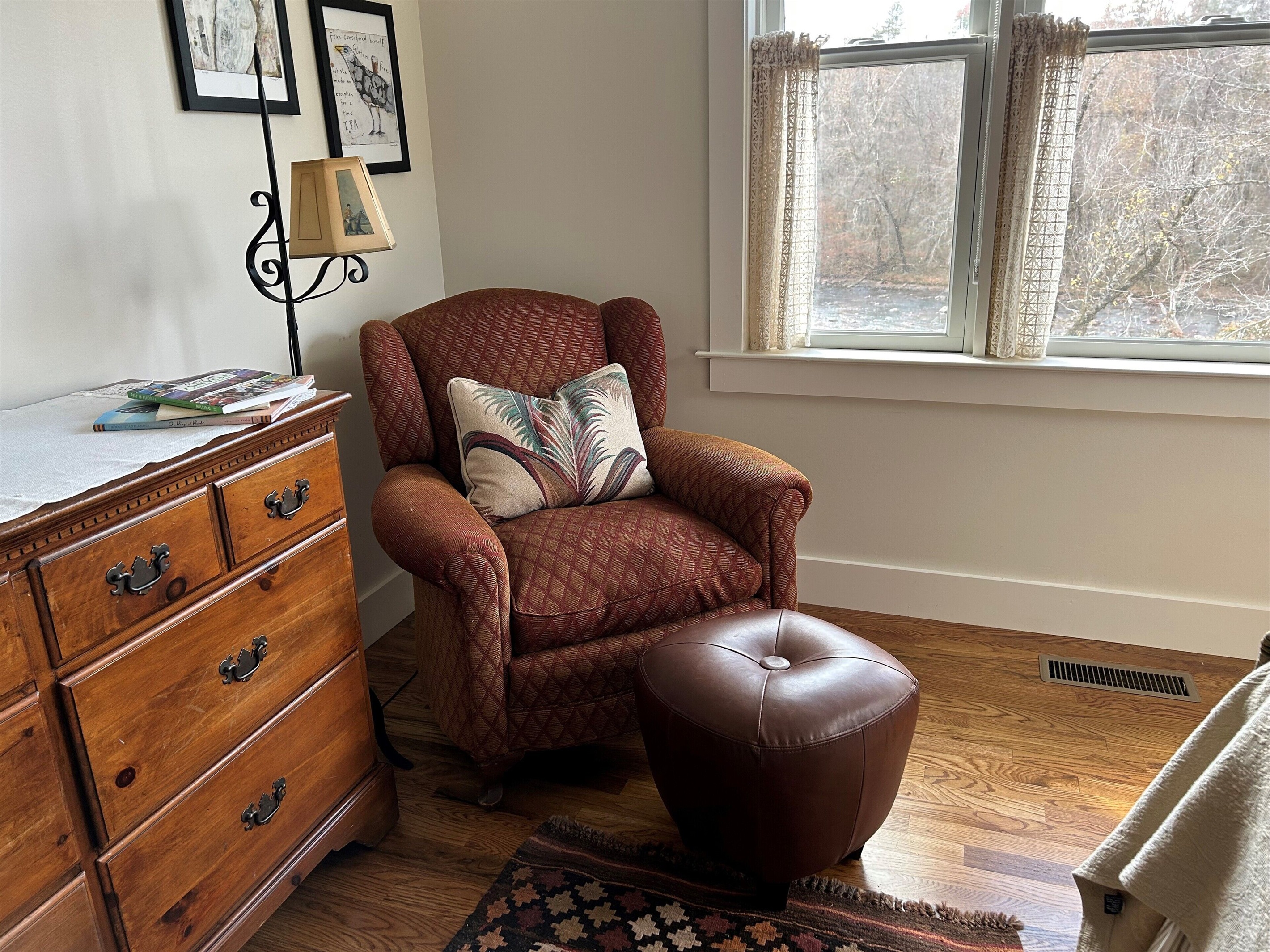 Cozy upstairs chair in queen bedroom with river views