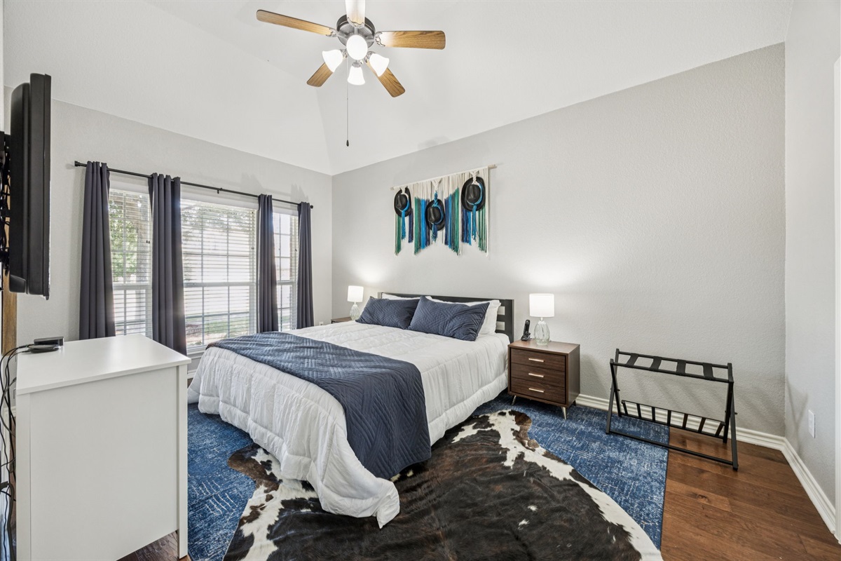 Cozy king bed with crisp, comfortable linens.