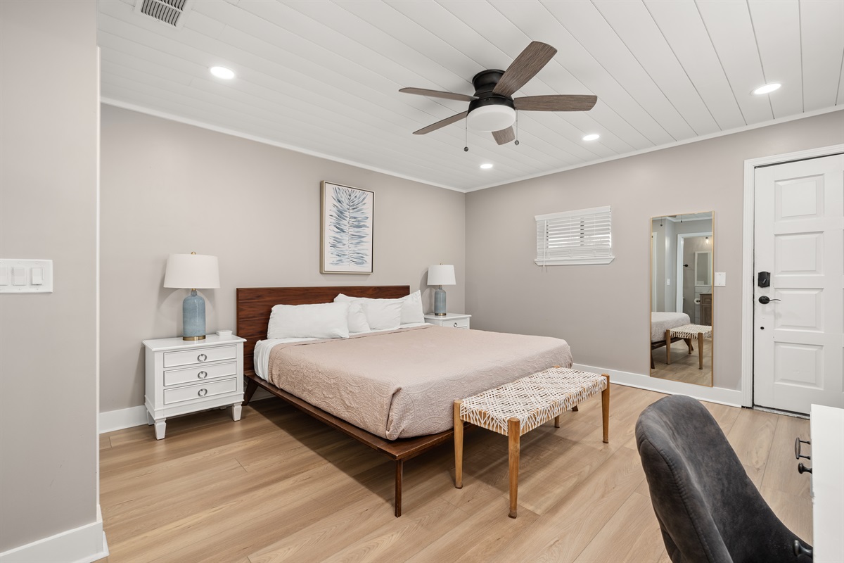 Upstairs Master bedroom with an ensuite bathroom. This beautifully decorated bedroom has a dedicated workspace.