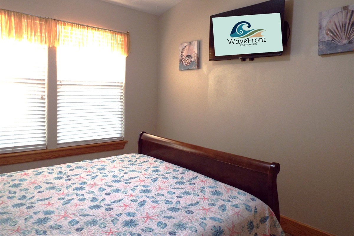 Side B bedroom #2 offers a flat screen TV and a queen bed