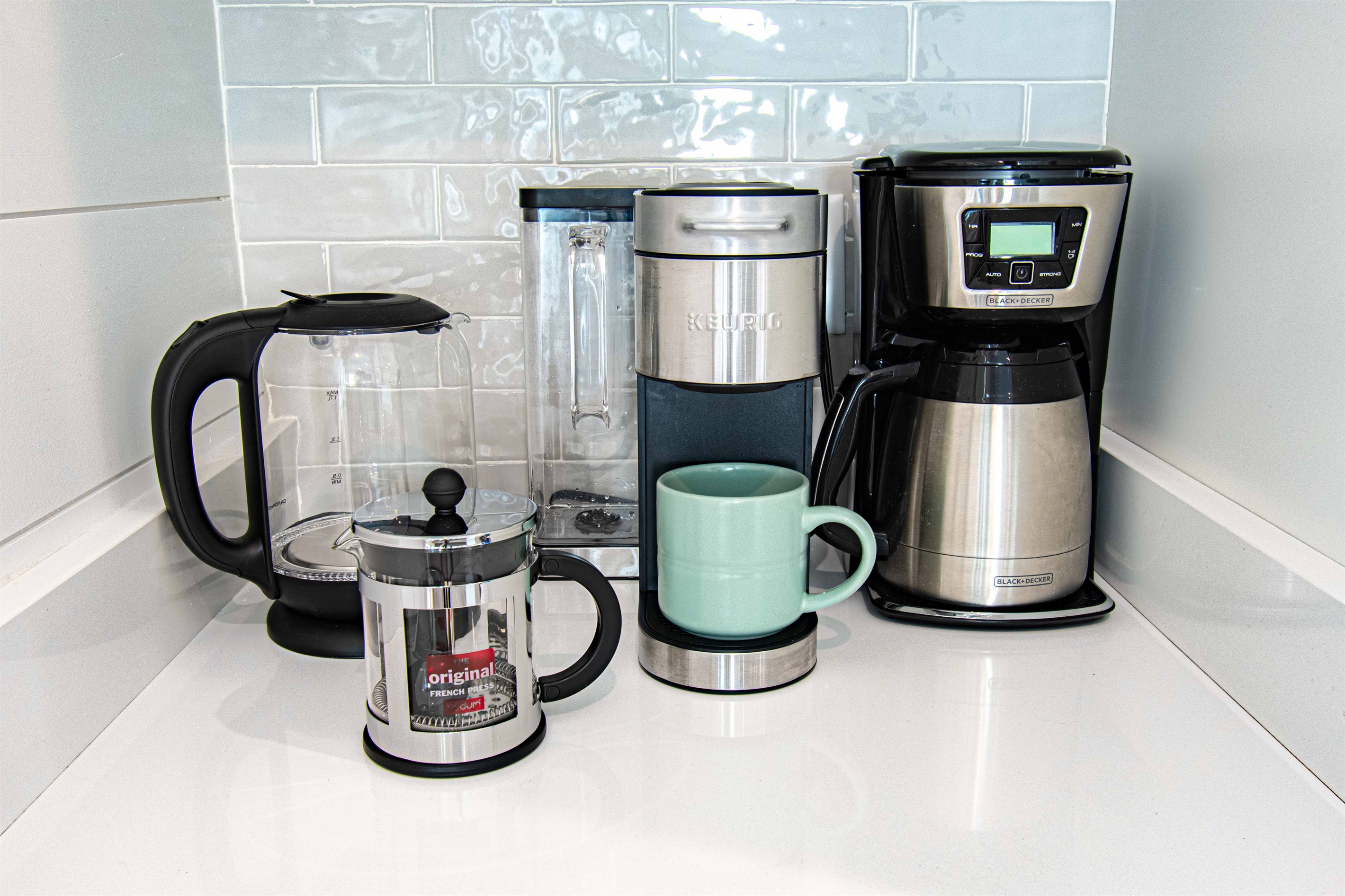 Keurig, French Press, Drip Coffee Pot and Tea kettle cover all your tea and coffee needs for a glorious morning.