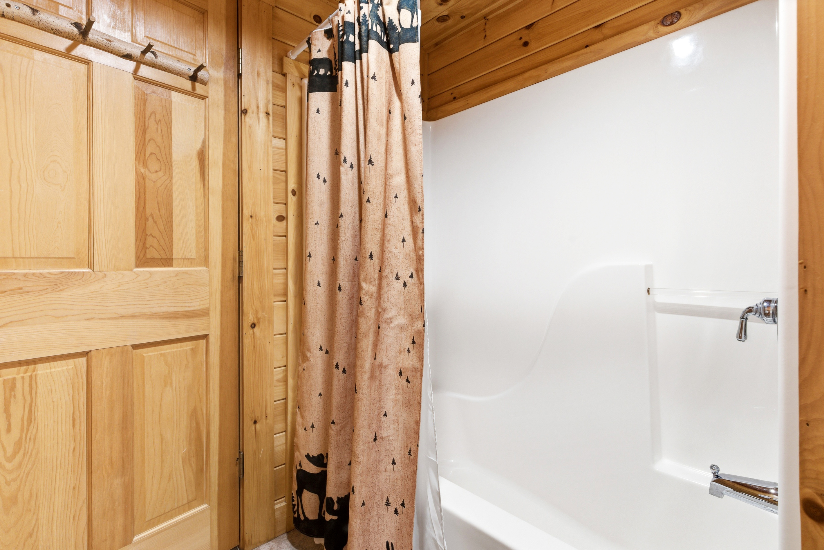 Full bathroom equipped with a tub and shower combination for added convenience.