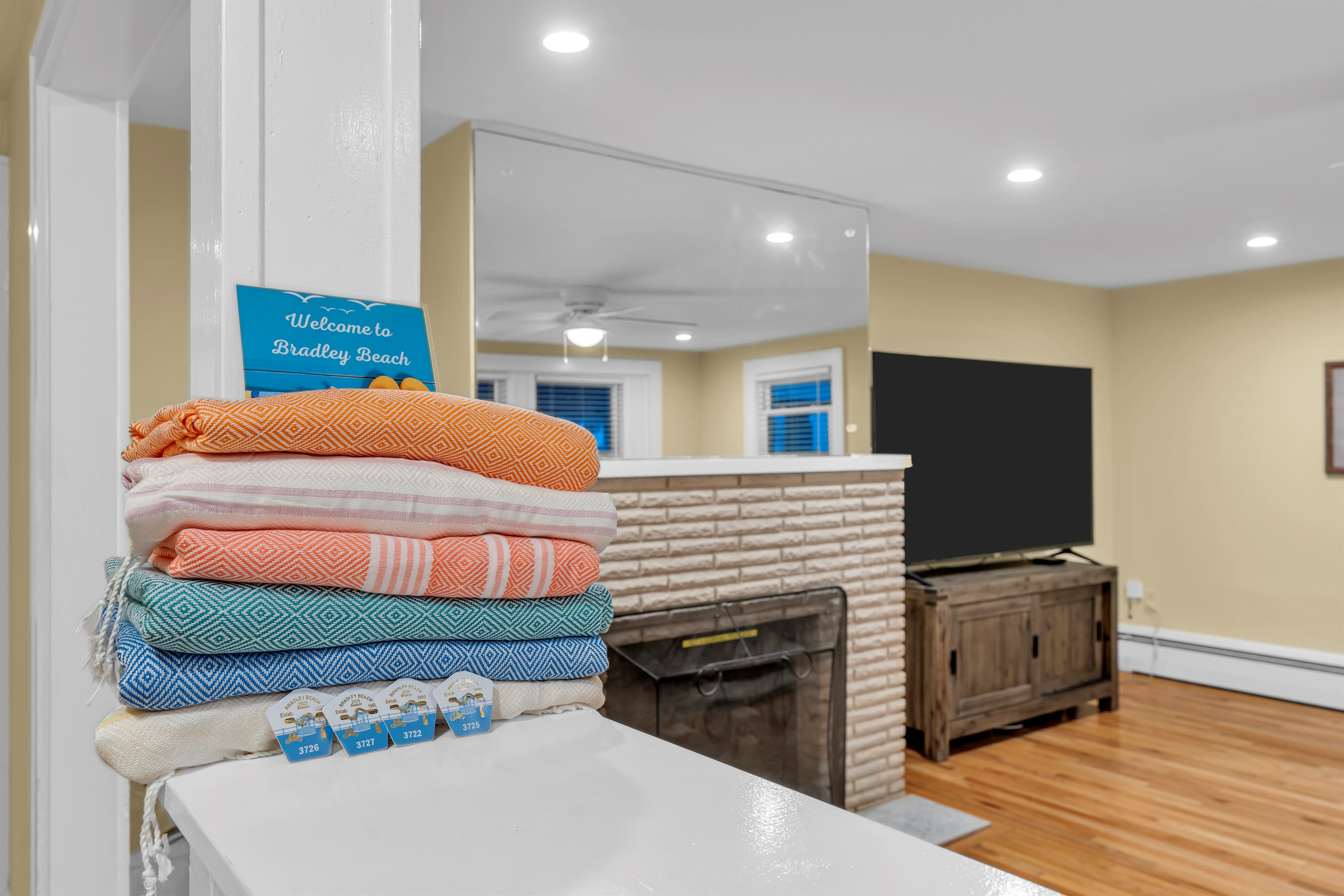 4 beach badges, and all of the beach essentials like towels, chairs and an umbrella for those beautiful beach days.