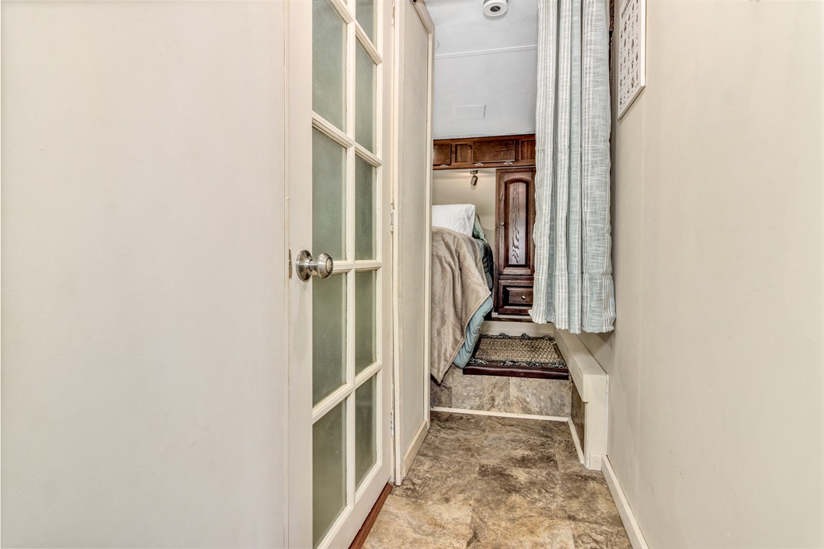 Narrow walkway to bedroom