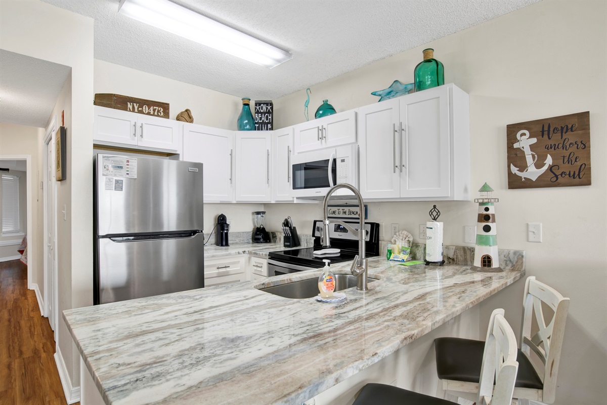 Kitchen view and breakfast bar seating 