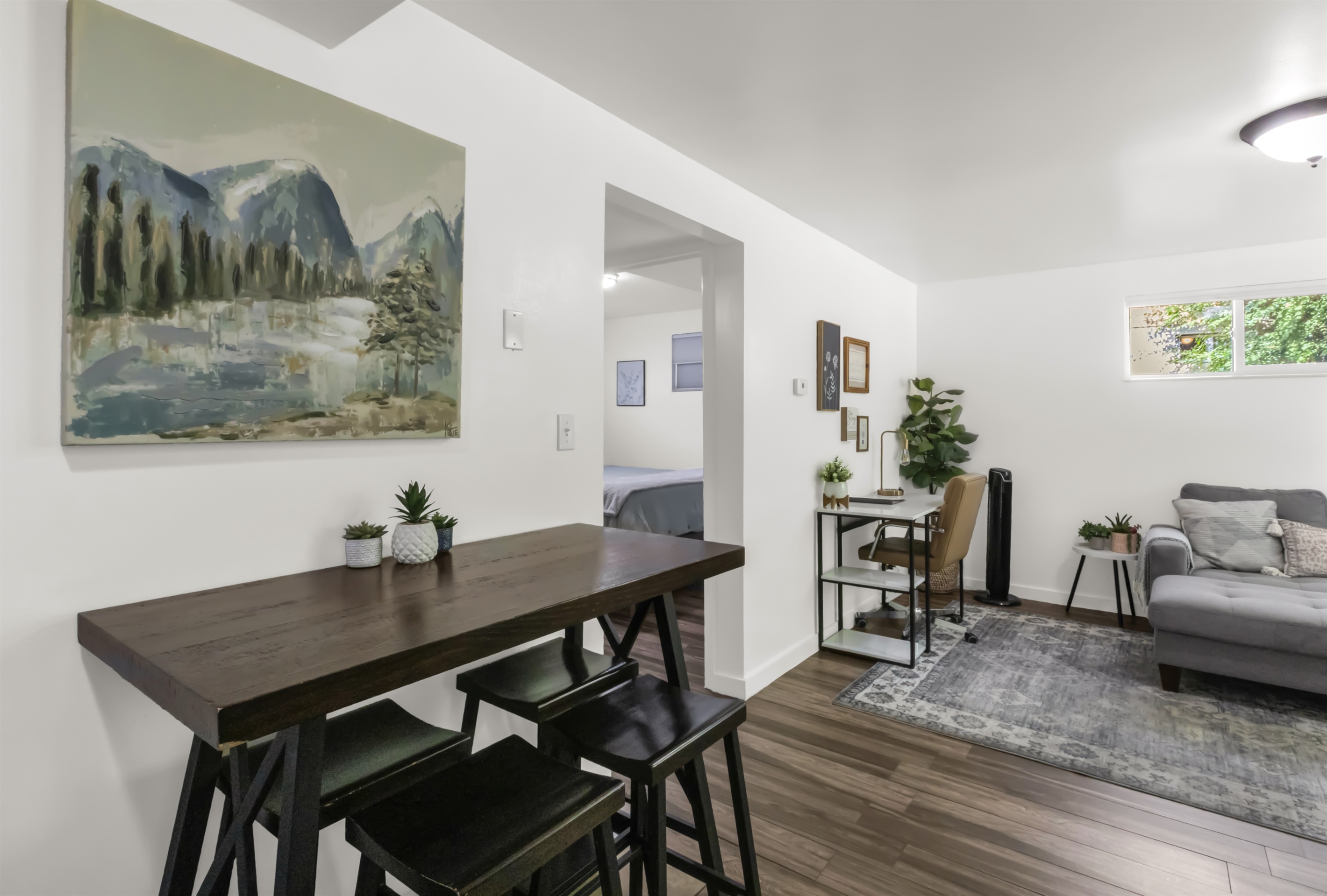 Dining room, workspace, and living room.