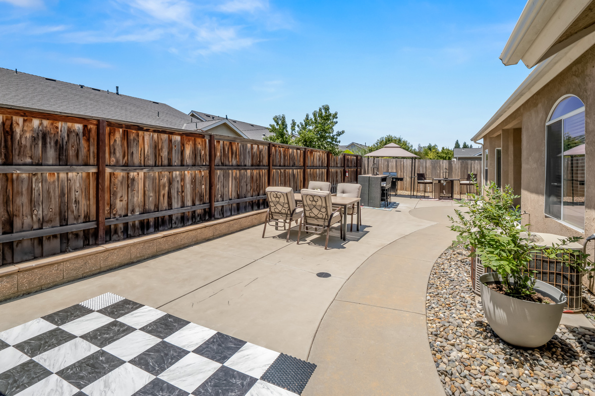Guests of all ages will love this inviting outdoor space, complete with classic oversized games, comfortable seating, and a private setting for enjoying time together.