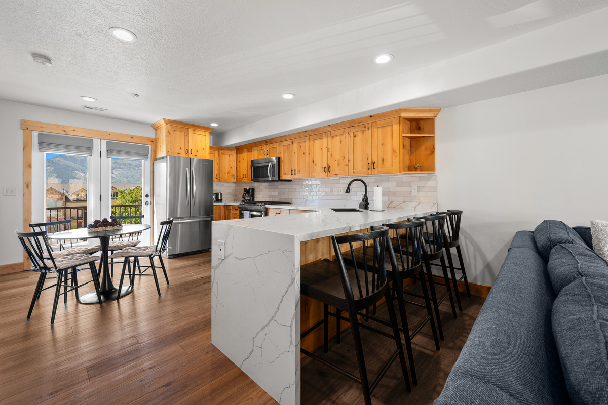 The open-concept kitchen and dining area keeps everyone connected while meals are being prepared.