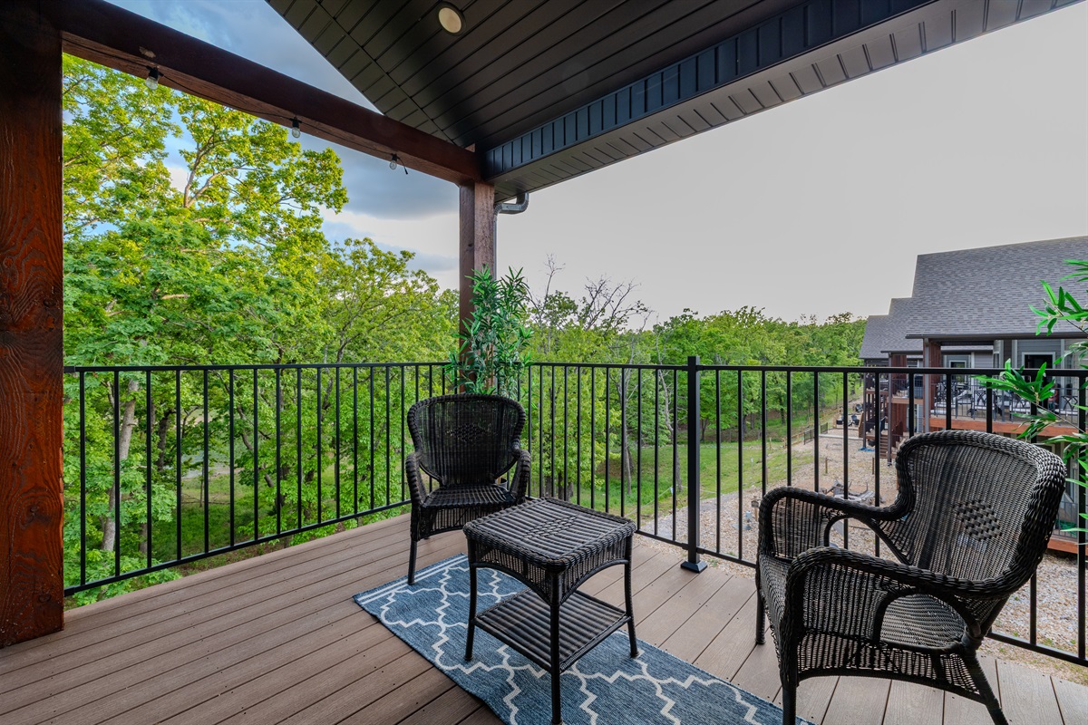 Covered deck with wooded views