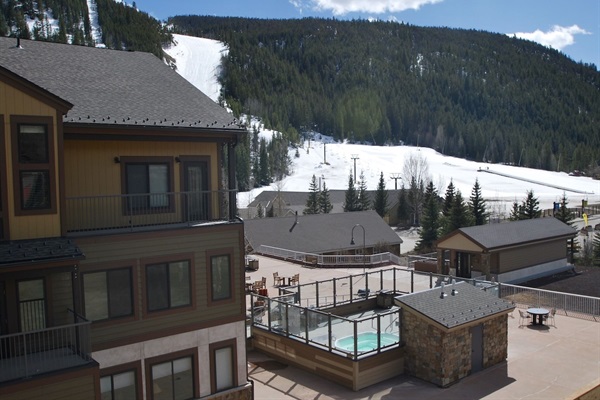 Views from condo & deck of ski school, slopes, hot tubs, fire pit, club house.