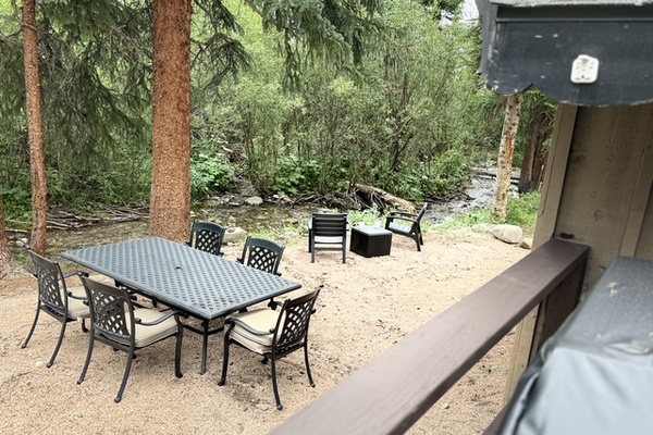 Gather for an outdoor meal, then move closer to the creek to relax and enjoy the peaceful mountain setting.