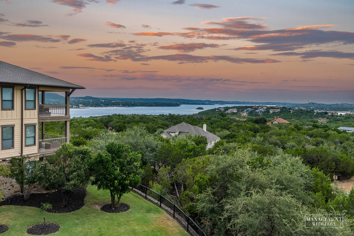 Hilltop condo community surrounded by the Texas Hill Country with Lake Travis just beyond.