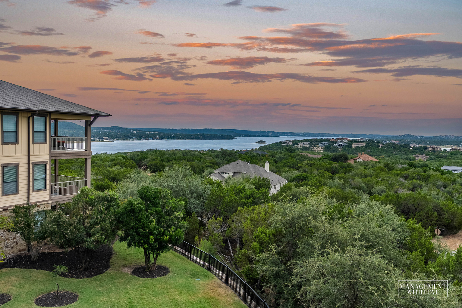Hilltop condo community surrounded by the Texas Hill Country with Lake Travis just beyond.