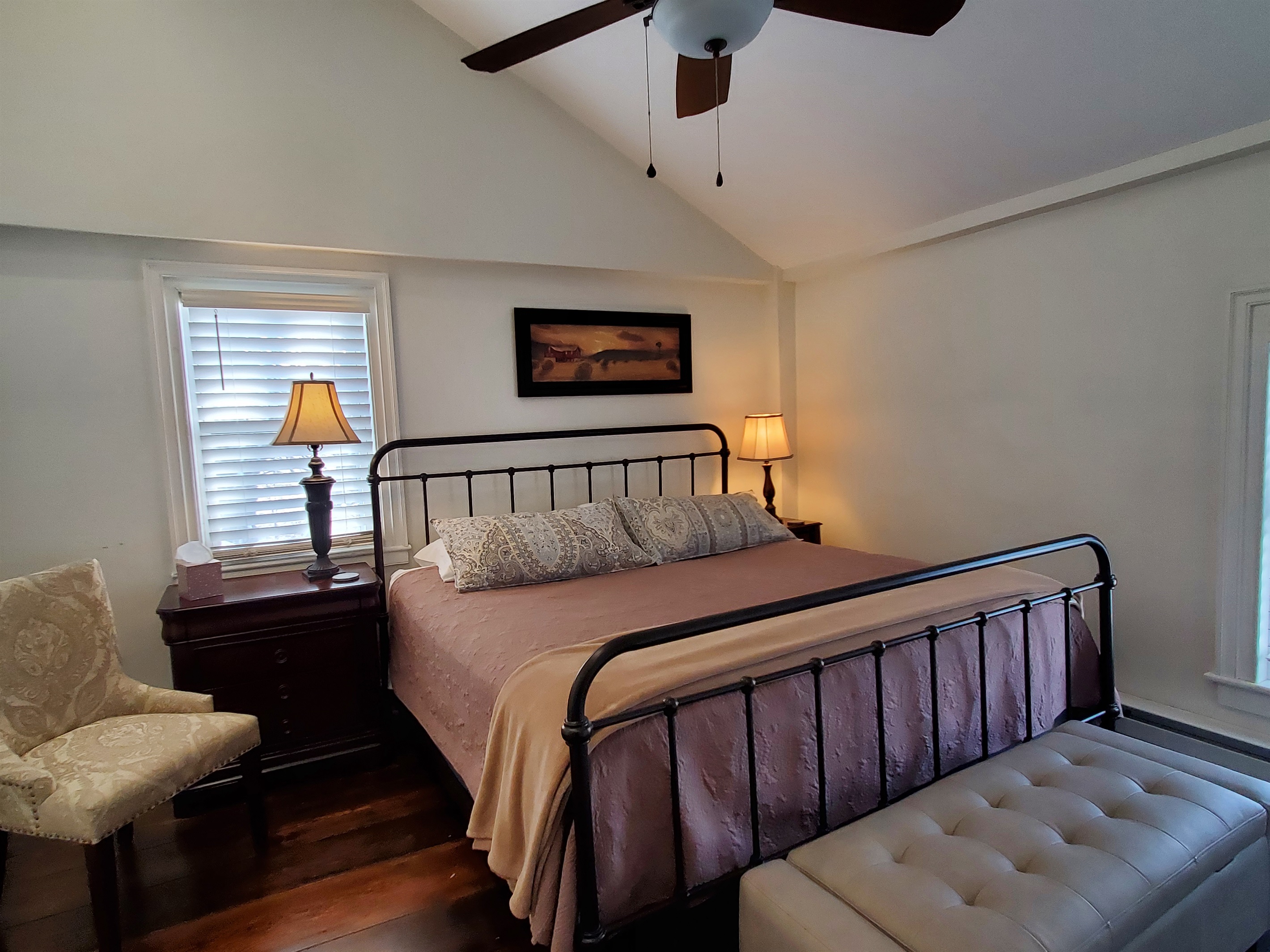 Cathedral ceiling adds drama to king bedroom