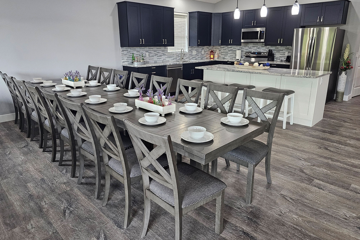 Spacious dining table for shared meals, celebrations, and memories.  Seats 16.