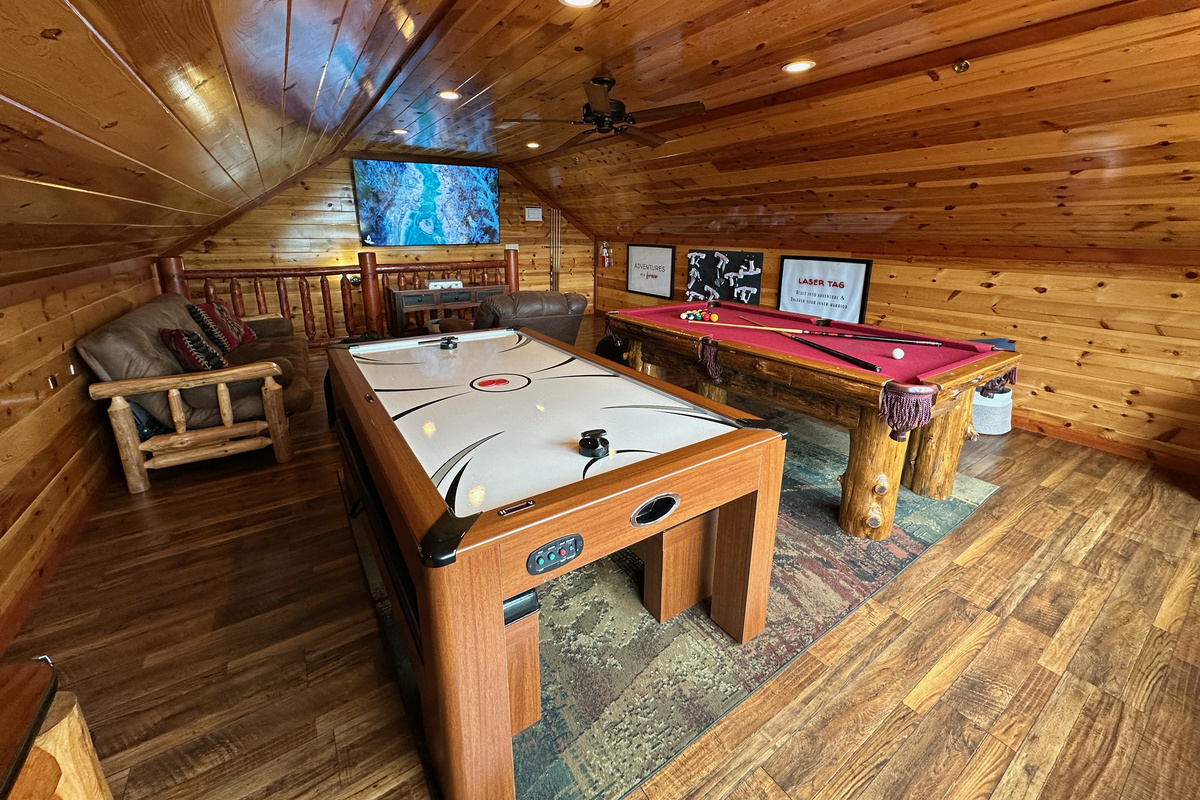 Our spacious entertainment loft designed for all ages including pool, air hockey, 2-player arcade, laser tag, poker set and board games. 