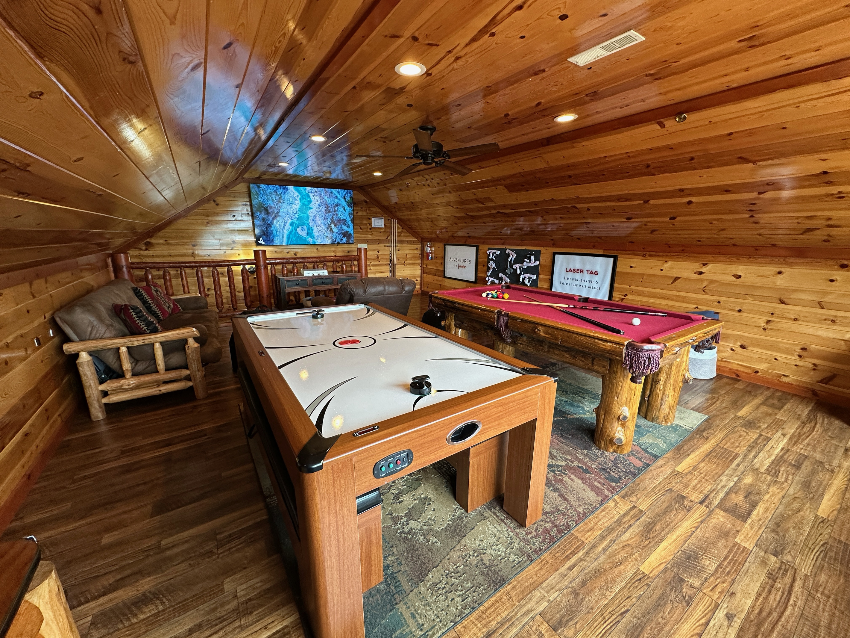 Our spacious entertainment loft designed for all ages including pool, air hockey, 2-player arcade, laser tag, poker set and board games. 