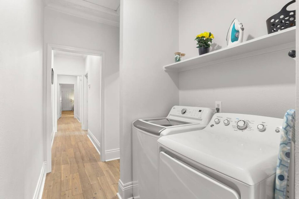  No need to overpack with your own new washer and dryer and complimentary detergent for a mid-stay wash! Plus iron and ironing board to get you ready for a night out!  Plus note the gorgeous wood floors (like the rest of the house)
