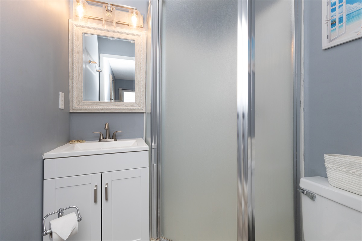 Master bathroom with vanity and glass shower enclosure
