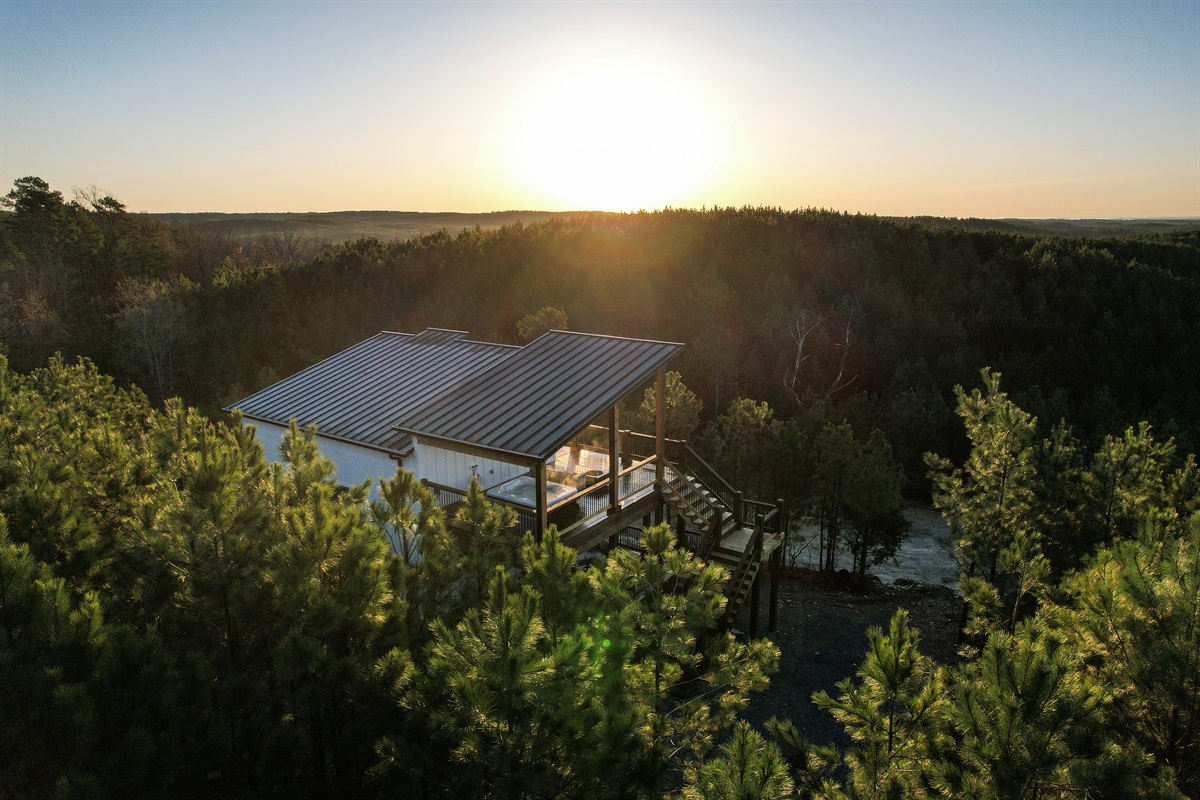A private, resort-style cabin with no visible neighbors and panoramic views for miles. Enjoy a hot tub, cocktail pool, firepit, telescope & swing sofa. Perfect for couples seeking romance, stargazing, and total relaxation.