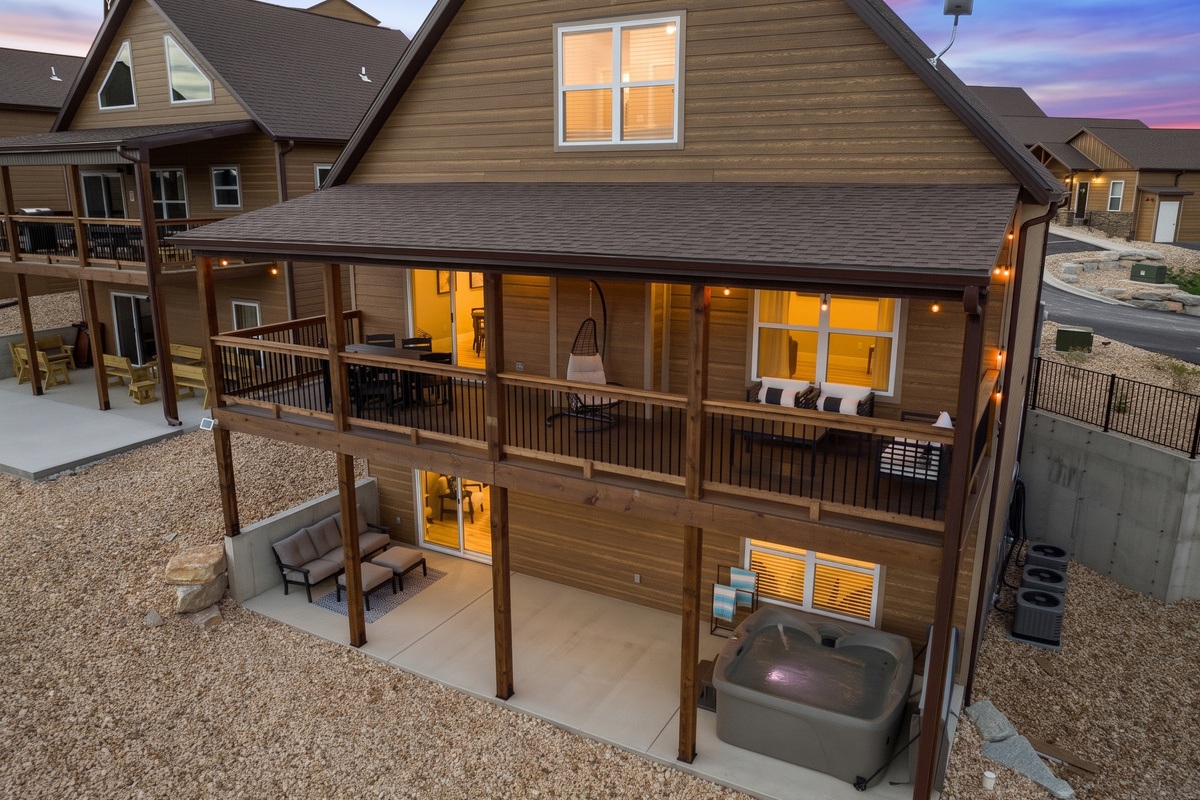 Back view of property at twilight