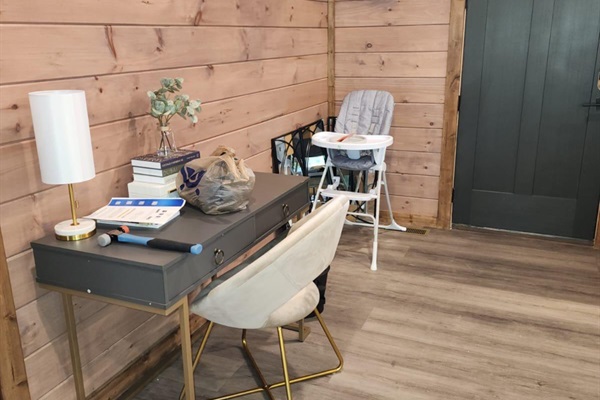 Cozy reading nook with modern decor and wood paneling