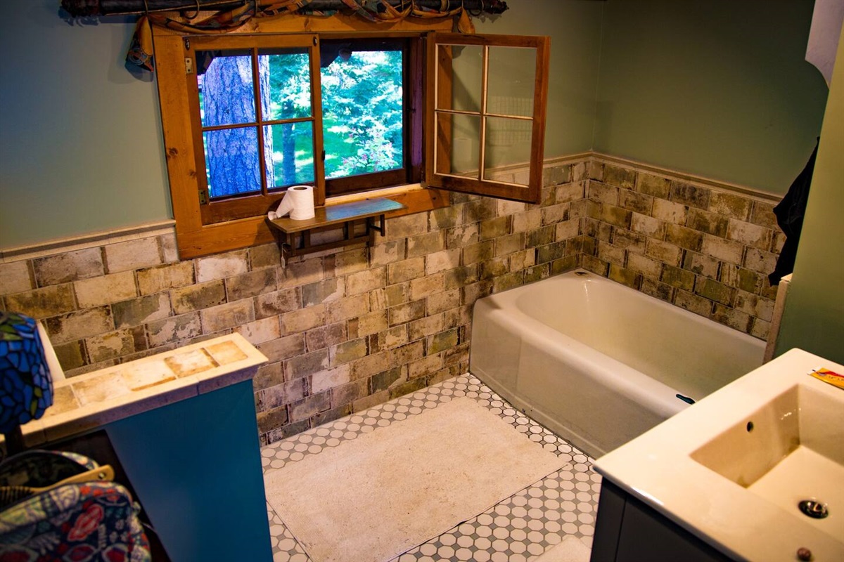Private full bathroom attached to primary bedroom with bath tub.