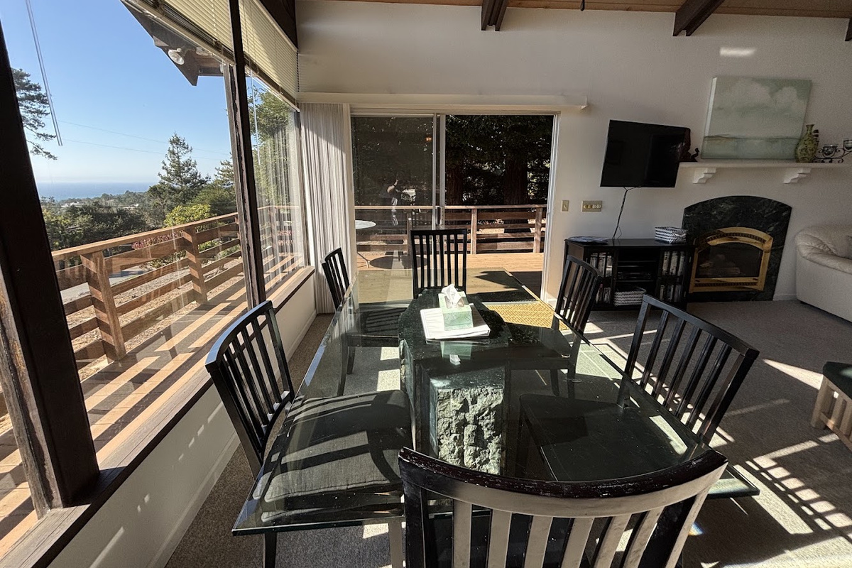Dining area with ocean view and access to deck