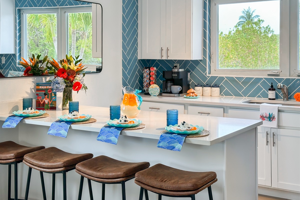 The kitchen island has additional 4 bar seats by the island.
