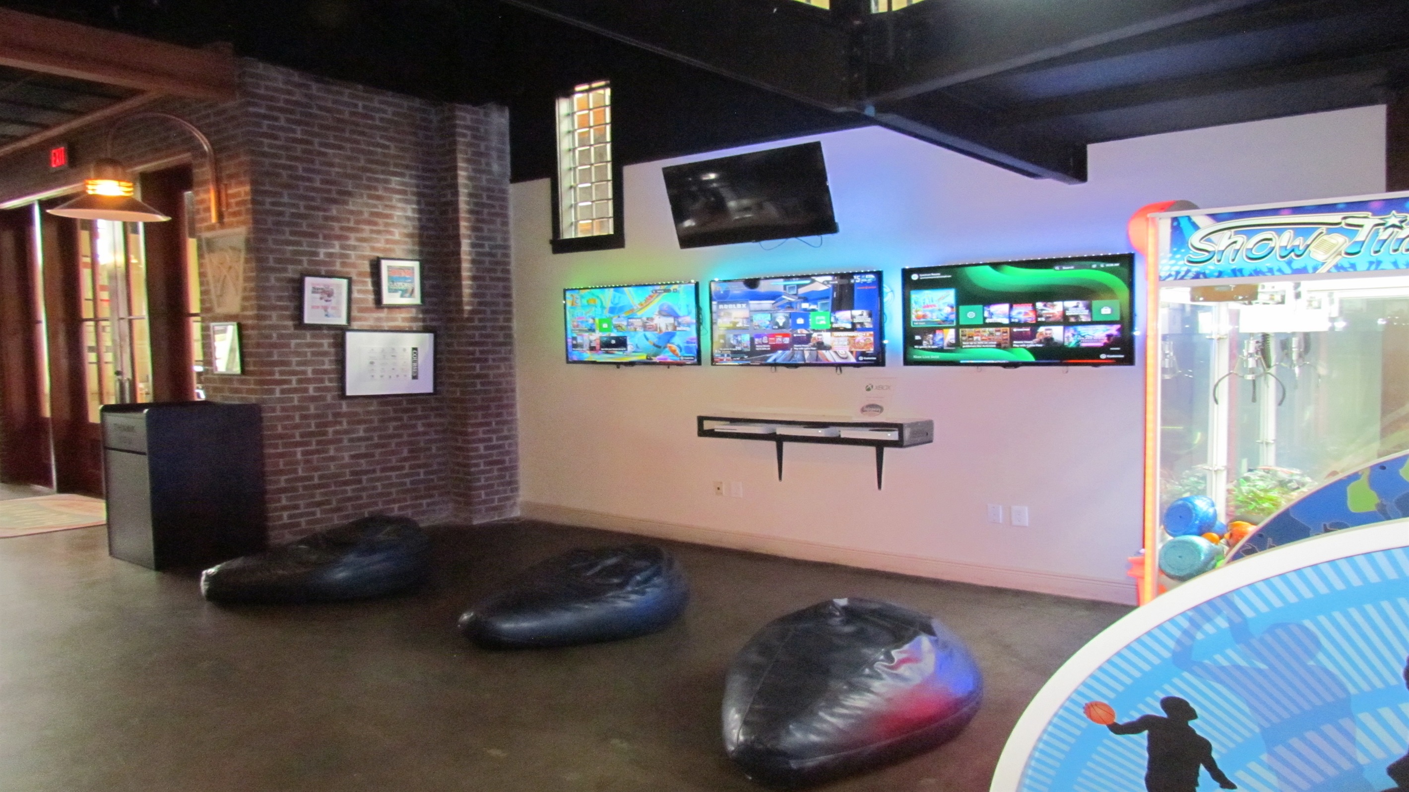 Unleash your inner gamer at the Village Hideaway's vibrant arcade, featuring a wide array of classic and modern games including basketball, shuffleboard, and more, for endless family fun.