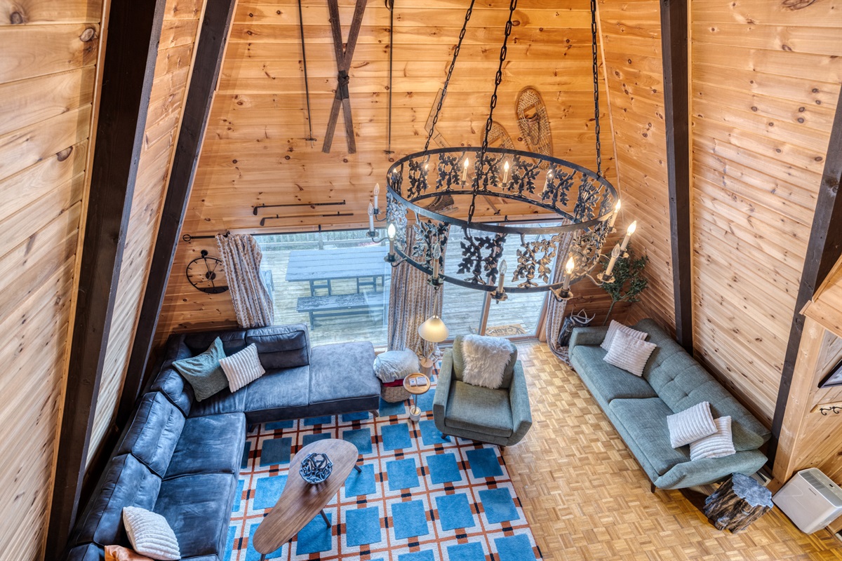 This spacious area boasts high, vaulted ceilings and an impressive chandelier, creating an airy and open ambiance.